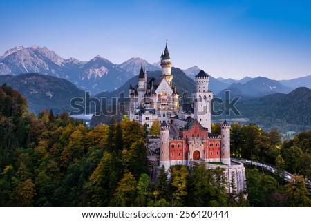 Famous Neuschwanstein Castle in Bavaria, Germany, before sunrise Royalty-Free Stock Photo #256420444