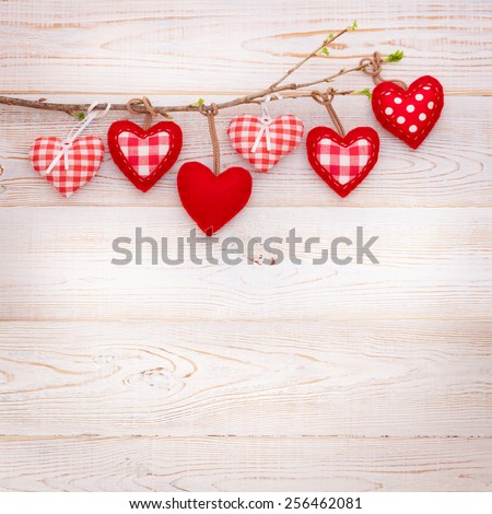 Valentine day love beautiful. Heart hanging on branch of tree on wooden background