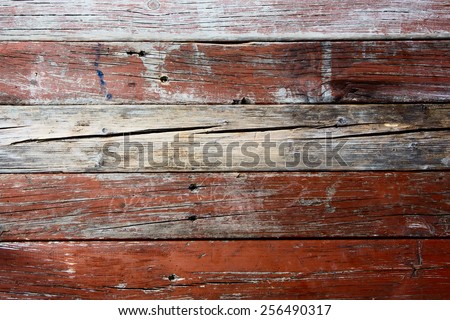 Old weathered barn wood texture with knots and nail holes.