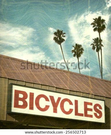  aged and worn vintage photo of bicycle sign                              
