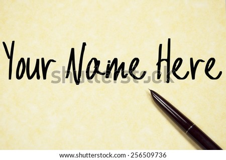 your name here text write on paper 