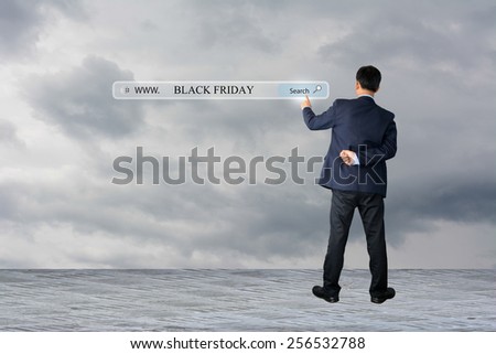 Business man hand pointing BLACK FRIDAY
 