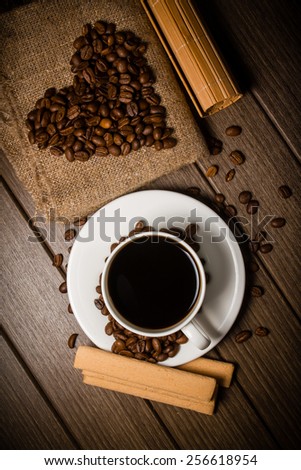 cup of coffee with coffee beans