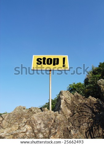 stop sign billboard in the beach