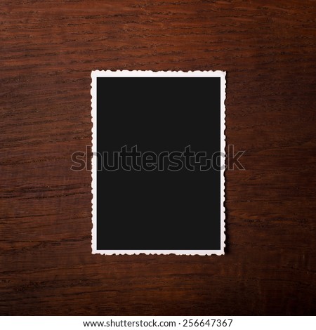 Scalloped photo on wooden background