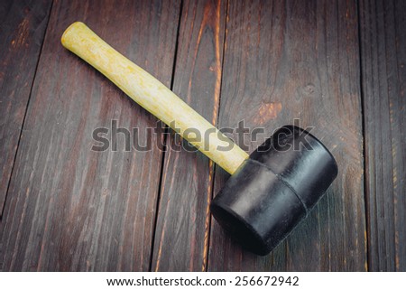 Hammer on wooden background - vintage effect style picutres