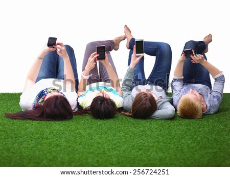 Group of young people having fun in Grass