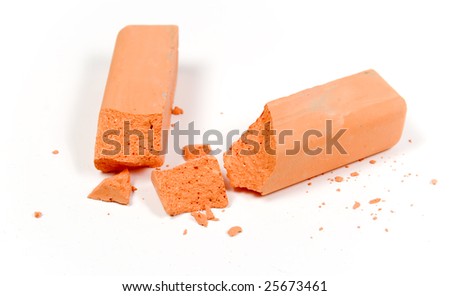 Close-up colored crushed orange chalk on white