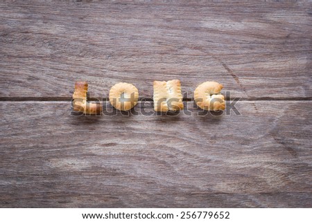 Long text with cookies and blank space on the wooden background