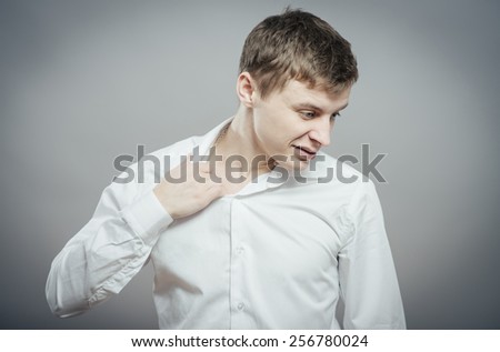 tired businessman taking off necktie
