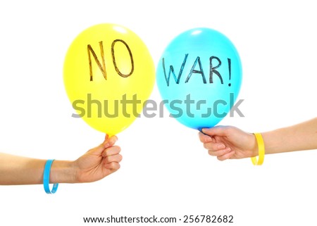 Hands holding blue and yellow balloons - no war concept