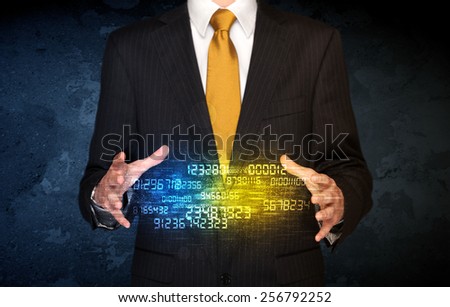 Businessman holding a shining number cloud in front of his body 