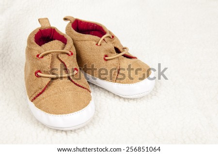 pair of baby shoes on fur