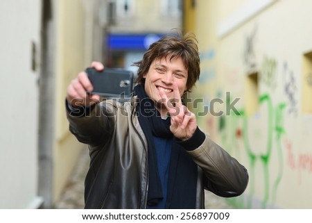 City hipster making selfie