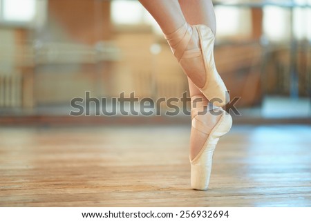 beautiful legs of a dancer in pointe Royalty-Free Stock Photo #256932694