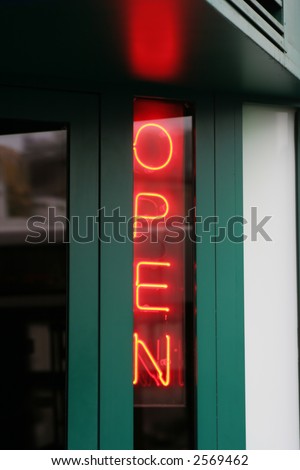 a neon open sign on bar in vienna, austria