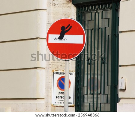 A funny Sign on a street in Naples, Italy