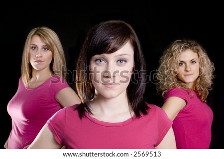 Three beautiful woman friends posing