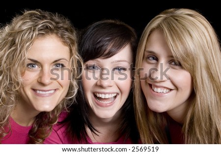 Three beautiful woman friends posing