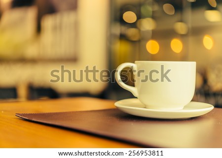 Black coffee in white cup on wooden table in coffee shop cafe - Vintage effect style pictures