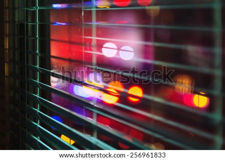 window with the background of the night city