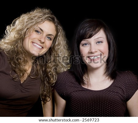 Two Pretty woman friends smiling