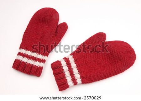 red mittens with white stripe on wrist over white Royalty-Free Stock Photo #2570029