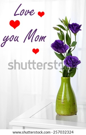 Beautiful bouquet of flowers in vase on window background, Mother's Day concept
