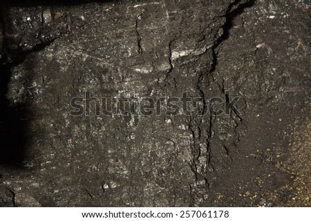 The black wall of coal Royalty-Free Stock Photo #257061178