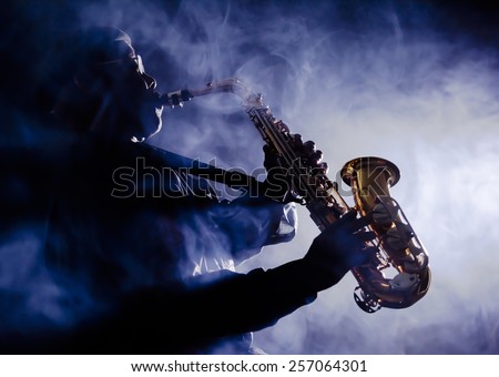African American jazz musician playing the saxophone Royalty-Free Stock Photo #257064301