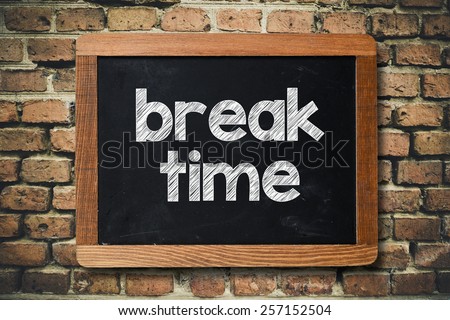 Break time on Blackboard. Break time on Blackboard on bricks wall Royalty-Free Stock Photo #257152504
