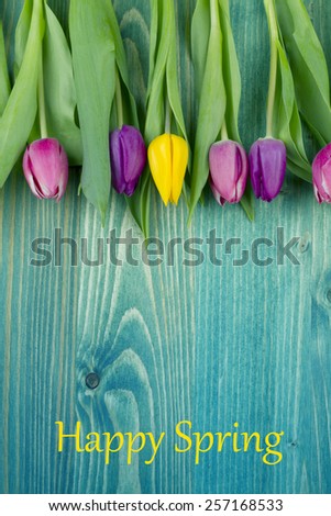 tulips over  wooden table