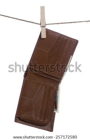 Brown leather wallet with dollar bill inside