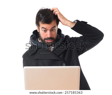 Man with laptop over white background