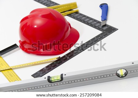 Photo of the Helmet and tools for construction drawings and buildings