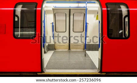 Inside view of London Underground, Tube Station, train stopped opening the door Royalty-Free Stock Photo #257236096