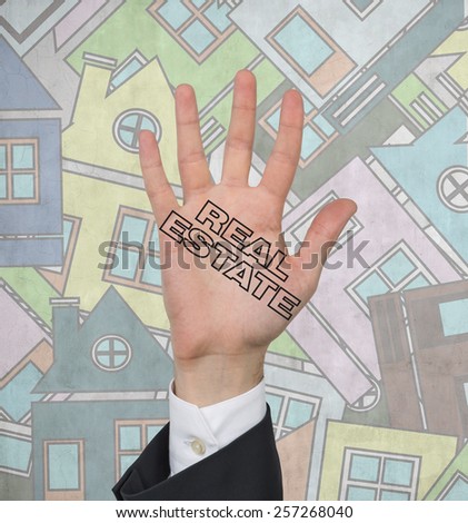 hand with drawing real estate on many house background