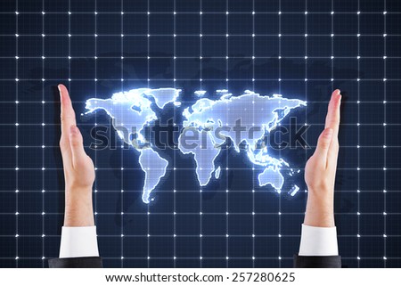 hands  holding world map interface on blue background