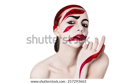 Studio portrait of a woman. Art make-up in red. On a white background