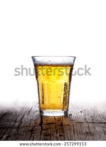 glass of beer isolated on white background wood