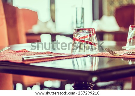 Selective focus point on glass in restaurant - vintage effect style pictures
