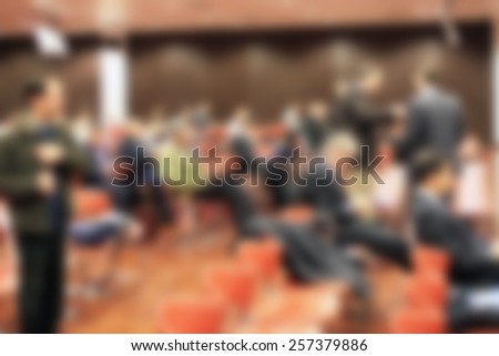People in meeting, generic background. Intentionally blurred editing post production.