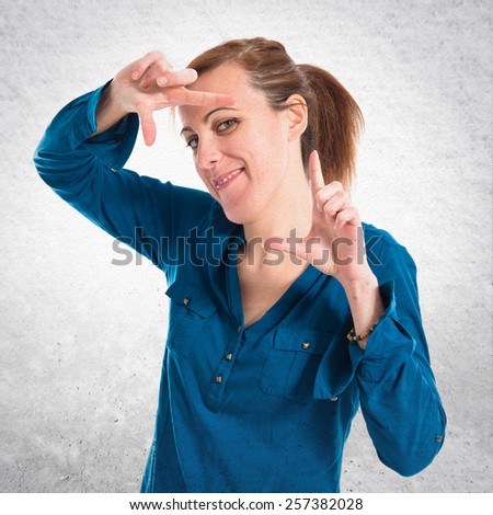 Woman focusing with her fingers 