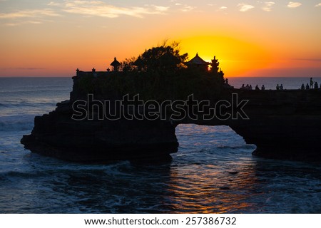 sunset over hindu temple Pura Tanah Lot, Bali, Indonesia Royalty-Free Stock Photo #257386732