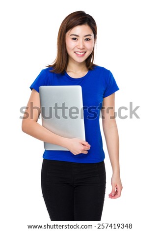 Woman holds  laptop
