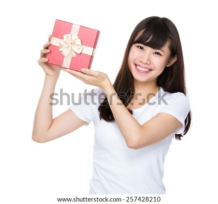 Young woman show with giftbox