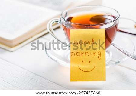good morning with smile and cup tea. Royalty-Free Stock Photo #257437660