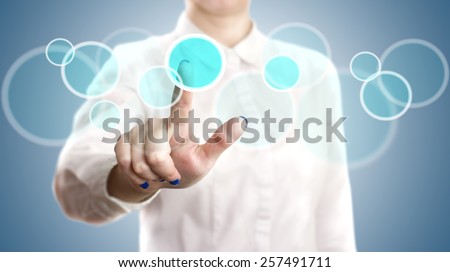 woman pushing on a touchscreen interface