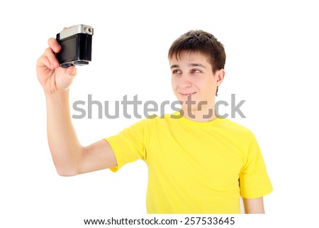 Teenager take a Self Portrait with Vintage Photo Camera on the White Background