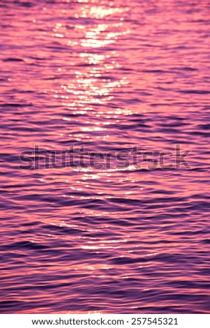 Blur background of the water surface. Vertical filtered defocused shot